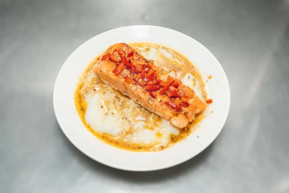 Salmon over grits